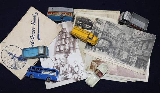 Various toy cars and mixed postcards